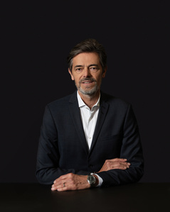 Employee low key business portrait with dark neutral background photographed in Zurich, Switzerland