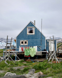 Greenlandic house in a small settlement in north west Greenland. – Stand up paddling adventure.