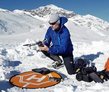 Outdoor and adventure Switzerland based photographer Jean-Luc Grossmann preparing his drone for an outdoor mountain story. 