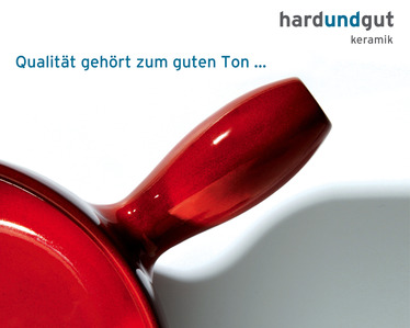 Red pan photographed in the studio in front of white background.