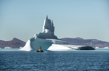 Stand up paddling in front of huge iceberg in Greenland on an out of this world adventure – Stand up paddling expedition.