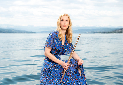 Portrait set of Swiss Flautist Nolwenn Bargin posing next to Lake Zurich and photographed by photographer in Zurich.