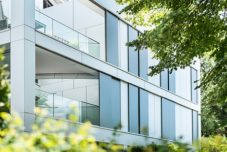 Architecture photography of building in Einsiedeln using trees in the foreground, Switzerland.