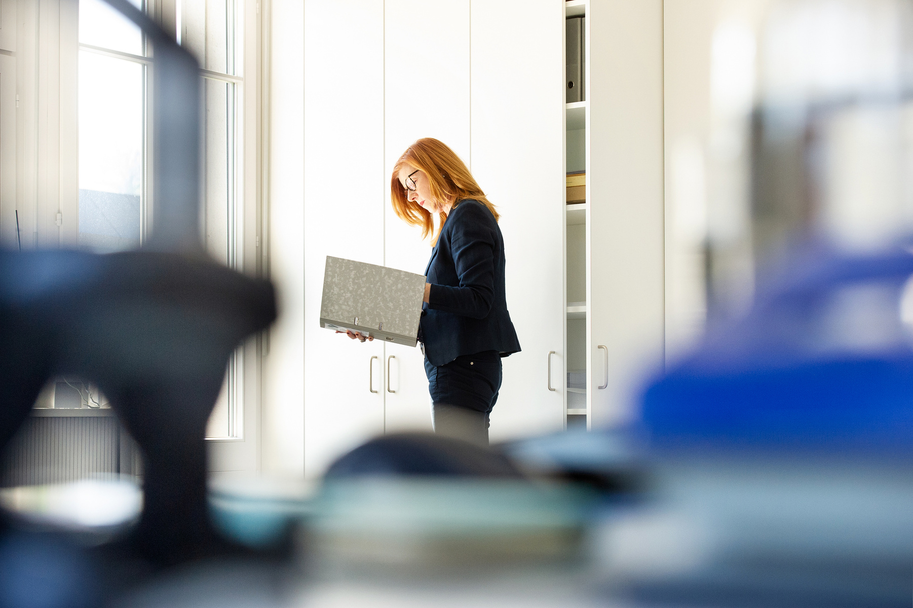 Employee reading documents in the office 