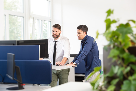 Discussion in front of the computer.
