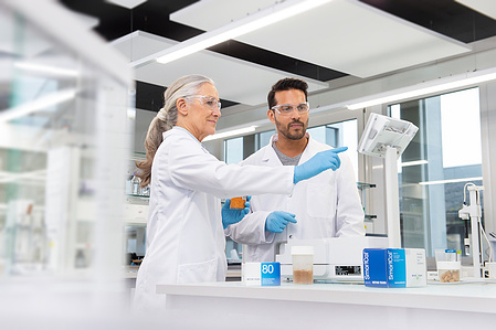 Two employees working together in a pharmaceutical laboratory in Zurich, Switzerland.