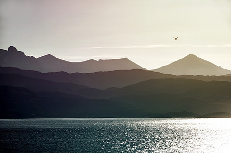 Sea and mountain landscape under the midnight sun.