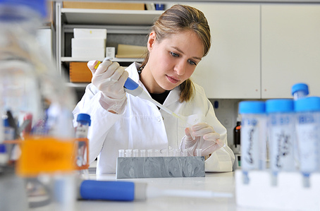 Pharma industry photograph of person working in the lab.