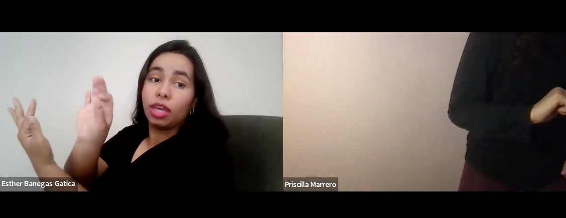 two zoom squares with Esther on the left pretending to write something midair and Priscilla on the right only showing half of her torso and one hand folded in to her stomach
