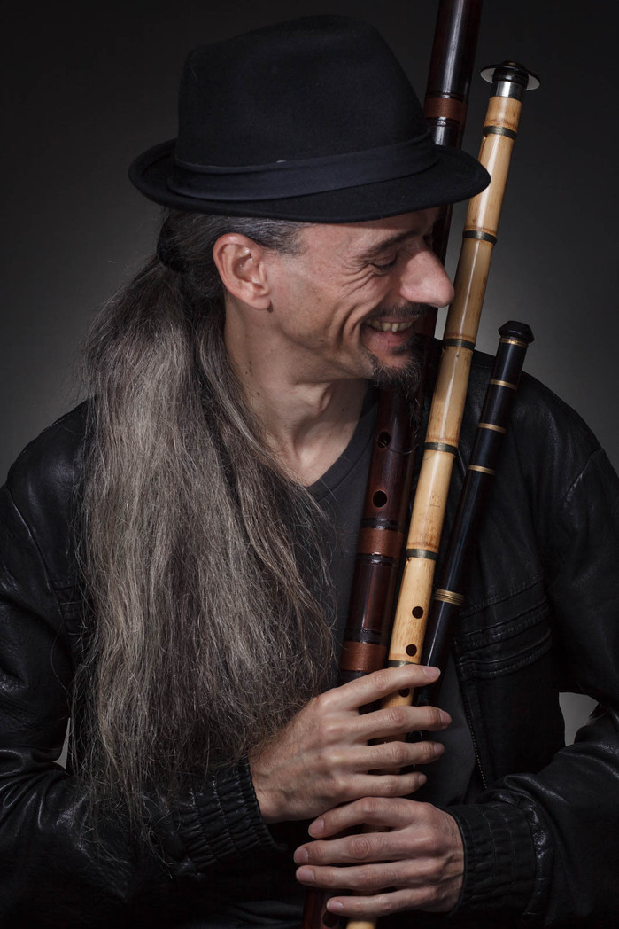 Portrait of musician Olivier Milchberg. A master of intruments like the guitar, saz, bouzouki, assortments of flutes to name a few.