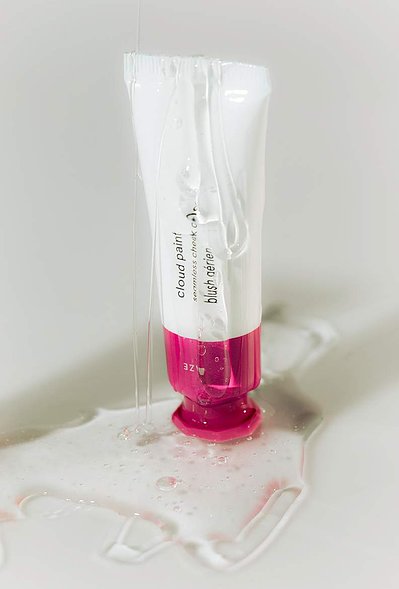 Glossier Cloud Paint product photography dripping in gloss.