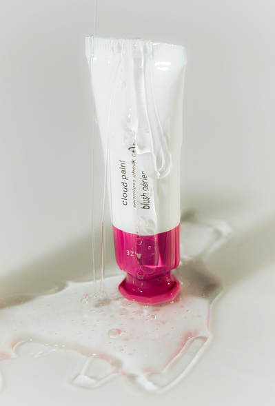 Glossier Cloud Paint product photography dripping in gloss.