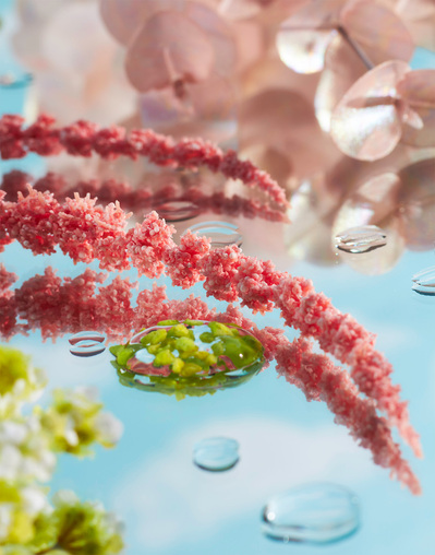 Vivid faux floral still life with pinks, greens and blues.