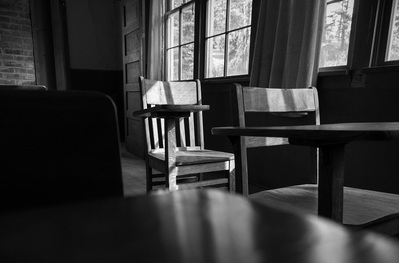 Garnet Ghost Town school house desk in black and white.
