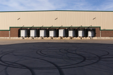 Receiving dock and parking lot in high contrast sunlight and shadow. 