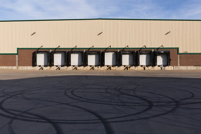 Receiving dock and parking lot in high contrast sunlight and shadow. 