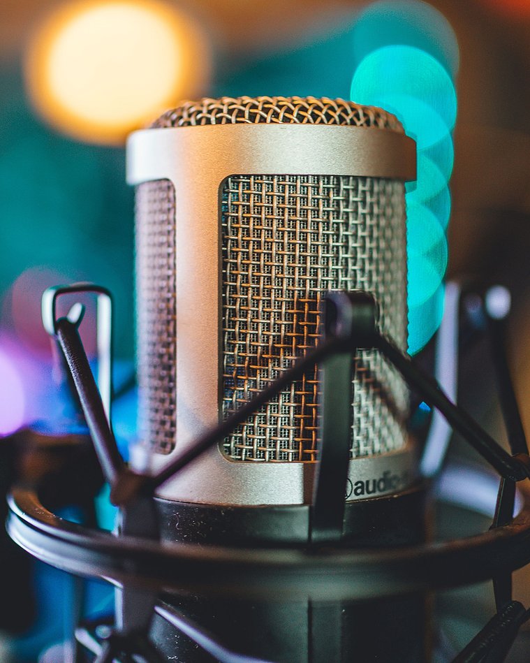Radio Production Studio Microphone. Photo by Thomas Le on Unsplash