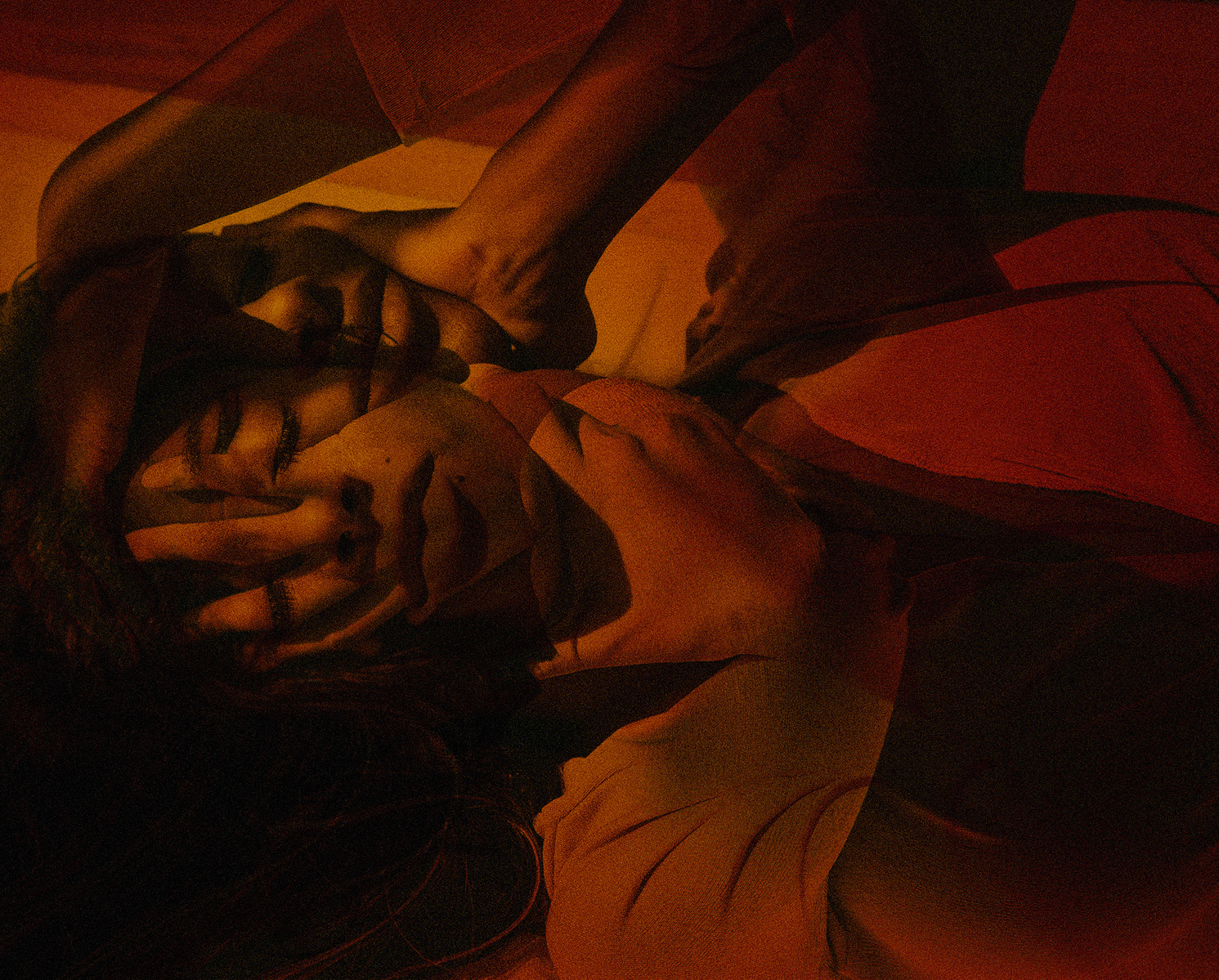 Black woman laying on the floor in double-exposed photo.
