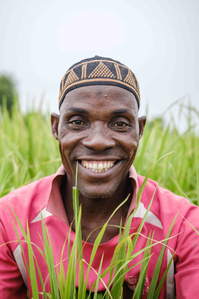 YOLA, NGA - October 5, 2023: Portrait of Salihu Yahaya (42); a livestock farmer in his rice farm located in Dasin Hausa community, Fufoire LGA, Adamawa State Nigeria. Salihu Yahaya is a beneficiary of climate resilency project. After receiving the cash fr