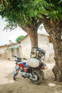 YOLA, NGA - October 3, 2023: Shaibu Mohammed purchased motorcycle parked in front of his house in Dasin Hausa community, Fufoire LGA, Adamawa State Nigeria. CREDIT: Taiwo Aina for IRC