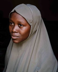 KADUNA, NGA - August 12, 2023:  Portrait of Asiya Sa’idu,17, in her house at Dogon Bauchi, Sabon Gari, Kaduna State, Nigeria. Asiya aims to be a doctor or a teacher, “My future ambition is to become a medical doctor because we don’t have enough female med