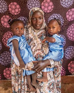 SOKOTO, NGA - July 4, 2023: Portrait of Maryam Musa and her twin children, AsmaÕu Kasimu &amp;amp;amp;amp;amp;amp; Halima Kasimu in their home at Kofar Market, Sokoto North LGA, Nigeria. CREDIT: Taiwo Aina 