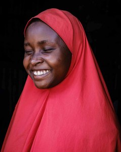 KADUNA, NGA - August 11, 2023:  Portrait of Asiya Ja’afar in her house at Anguwan Malamai, Zaria, Kaduna State, Nigeria. Asiya Ja’afar dropped out of school at a very young age due to long trekking distance which caused her punishments for latecoming and 