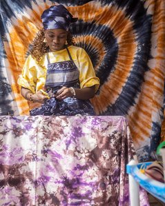 Kemi Alaro, tieing a fabric for a design. January, 22 2022. Abuja, Nigeria.