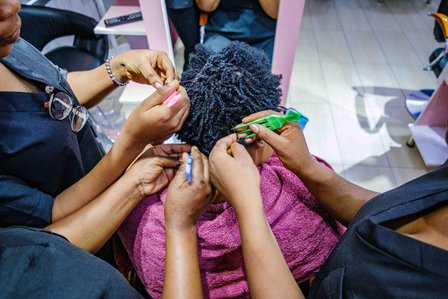 LAGOS, NG - February 1, 2023: Seyifunmi Bamigbowu; a hair stylist who uses and resells Mara Cruz hair products to her customers, making a customerÕs hair on February 1, 2023 in Lagos state, Nigeria. CREDIT: Taiwo Aina for Oxfam Novib