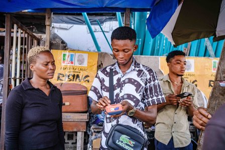 LAGOS, NGA - FEBRUARY 12, 2023: Ongoing POS transaction at JohnsonÕs stall. CREDIT: Taiwo Aina for The New York Times