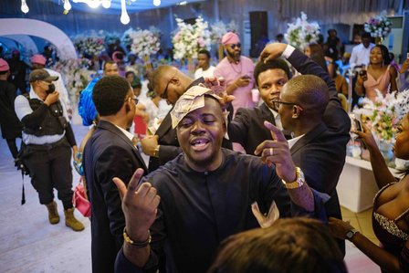 LAGOS, NGA - FEBRUARY 11, 2023: Naira sprayed in celebration at an wedding ceremony on February 11, 2023 in Lagos, Nigeria. Due to the change in currency and new cash policy, flow of cash is limited in parties also as there are not much money to celebrate