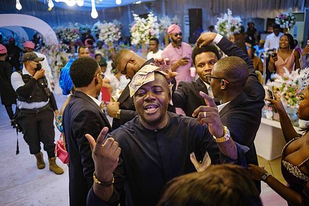 LAGOS, NGA - FEBRUARY 11, 2023: Naira sprayed in celebration at an wedding ceremony on February 11, 2023 in Lagos, Nigeria. Due to the change in currency and new cash policy, flow of cash is limited in parties also as there are not much money to celebrate