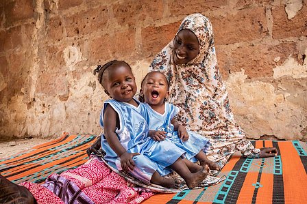SOKOTO, NGA - July 4, 2023: Portrait of Maryam Musa and her twin children, AsmaÕu Kasimu &amp;amp;amp;amp;amp;amp; Halima Kasimu as they play together in their home at Kofar Marke, Sokoto North LGA, Nigeria. CREDIT: Taiwo Aina 