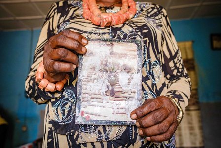 BAYELSA, NG - January 27, 2023: Chief Miriam Biseni holds a picture of her son spoilt by flooding in her home in Yenogoa, Bayelsa state, Nigeria. CREDIT: Taiwo Aina for Oxfam Novib

