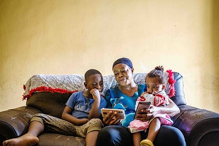 RIVERS, NG - January 28, 2023: Precious spends time with her children after making soap on January 28, 2023 in Port Harcourt, Rivers state, Nigeria. CREDIT: Taiwo Aina for Oxfam Novib