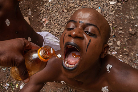 Student takes honey to clear his voice before his drama performance. July 30 2021, Kwara State, Nigeria.