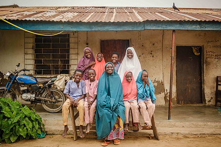 YOLA, NGA - October 4, 2023: Portrait of Faiza Habibu(60) and her family in her home in Dasin Hausa community, Fufoire LGA, Adamawa State Nigeria. Faiza Habibu is a beneficiary of Google climate resilency project which she utilized in expanding her fish f