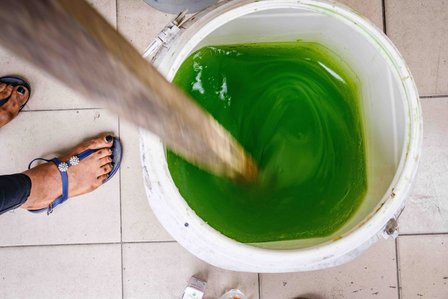 RIVERS, NG - January 28, 2023: Precious mixes chemical used in production of her home made soap on January 28, 2023 in Port Harcourt, Rivers state, Nigeria. Precious Jessica; a serial entrepreneur, she is also a farmer twice&#x2F;thrice a week. 
CREDIT: Taiwo 
