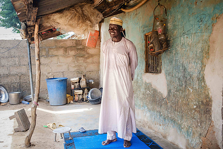 YOLA, NGA - October 3, 2023: Portrait of Shaibu Mohammed (51); a farmer in his house located in Dasin Hausa community, Fufoire LGA, Adamawa State Nigeria. Shaibu Mohammed is a beneficiary of Google climate resilency project. After receiving cash, he was a