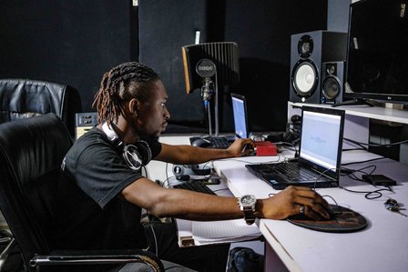 LAGOS, NGA - FEBRUARY 13, 2023: Portrait of Wisdom Odeje, a 34 year old Nigerian youth in his sound studio. CREDIT: Taiwo Aina for The New York Times