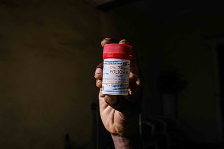 ABUJA, NGA - DECEMBER 5, 2023: Nkem Azinge holds her most important drug in her home, Wuse, Abuja, Nigeria. CREDIT: Taiwo Aina for The New York Times