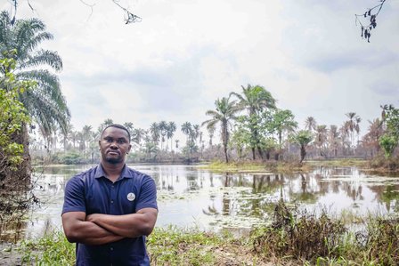 RIVERS, NG - January 27, 2023:  Portrait of Asanga Fabian in front of the land farming area destroyed due to oil spillage activities on January 27, 2022 in Rivers state, Nigeria. CREDIT: Taiwo Aina for Oxfam Novib