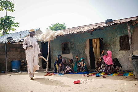 YOLA, NGA - October 3, 2023: Shaibu MohammedÕs family bid him farewell as he departs for farm in Dasin Hausa community, Fufoire LGA, Adamawa State Nigeria. Shaibu Mohammed is a beneficiary of Google climate resilency project. CREDIT: Taiwo Aina for IRC