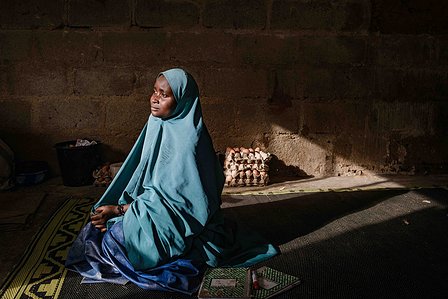 KADUNA, NGA - August 11, 2023:  Portrait of Asiya Ja’afar  at the poultry house at Anguwan Malamai, Zaria, Kaduna State, Nigeria. Asiya’s form of education is vocational as she’s dropped out of school at a young age. Her biggest goal right now is to own a