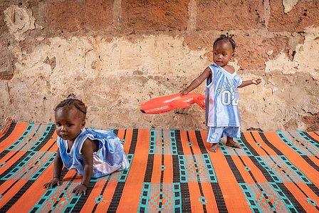 SOKOTO, NGA - July 4, 2023: AsmaÕu Kasimu and her twin sister playing in their home at Kofar Marke, Sokoto North LGA, Nigeria. CREDIT: Taiwo Aina 