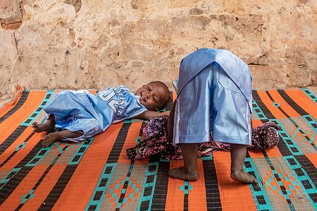 SOKOTO, NGA - July 4, 2023: AsmaÕu Kasimu &amp;amp;amp;amp;amp;amp; Halima Kasimu play together in their home at Kofar Market, Sokoto North LGA, Nigeria. CREDIT: Taiwo Aina 