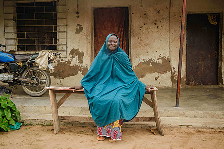 YOLA, NGA - October 4, 2023: Portrait of Faiza Habibu  in her home in Dasin Hausa community, Fufoire LGA, Adamawa State Nigeria. Faiza Habibu is a beneficiary of Google climate resilency project which she utilized in expanding her fish farming business. F