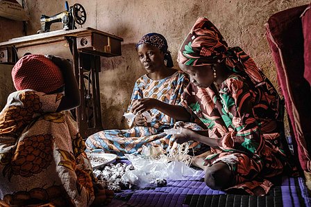 KADUNA, NGA - August 12, 2023: Asiya Sa’idu and her sisters packaging her tigernut snack in their home at Dogon Bauchi, Sabon Gari, Kaduna State, Nigeria. CREDIT: Taiwo Aina