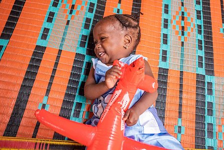 SOKOTO, NGA - July 4, 2023: Portrait of AsmaÕu Kasimu in their home at Kofar Marke, Sokoto North LGA, Nigeria. AsmaÕu started her nutrition treatment when she was 12 months old. With visible physical features and a MUAC of 12.8cm, AsmaÕu is now discharged