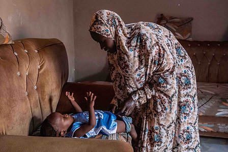 SOKOTO, NGA - July 4, 2023: AsmaÕu mum dresses for her in their home at Kofar Marke, Sokoto North LGA, Nigeria. CREDIT: Taiwo Aina 